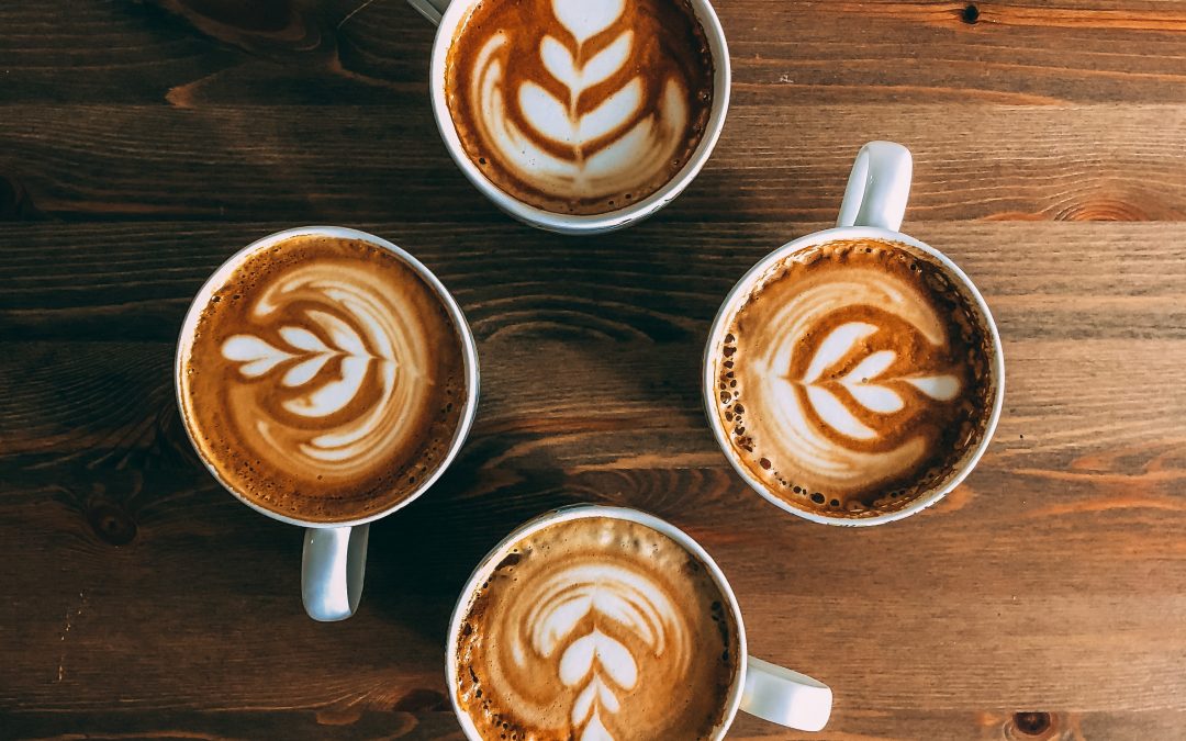 four mugs of latte arts