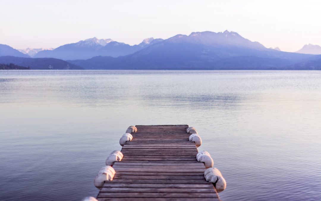 brown wooden boat dock in gray skies background